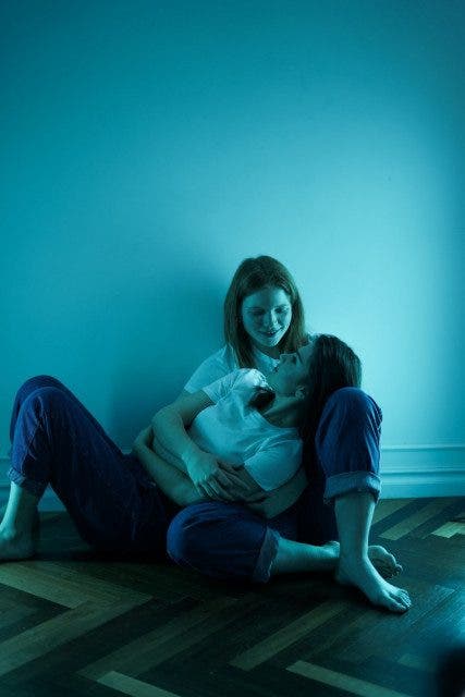 women in white t shirt sitting on floor 3693917