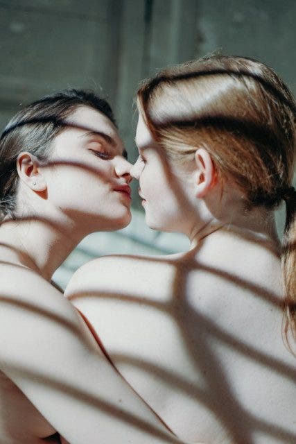 photo of women kissing 3693940