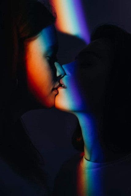 photo of women kissing 3693878